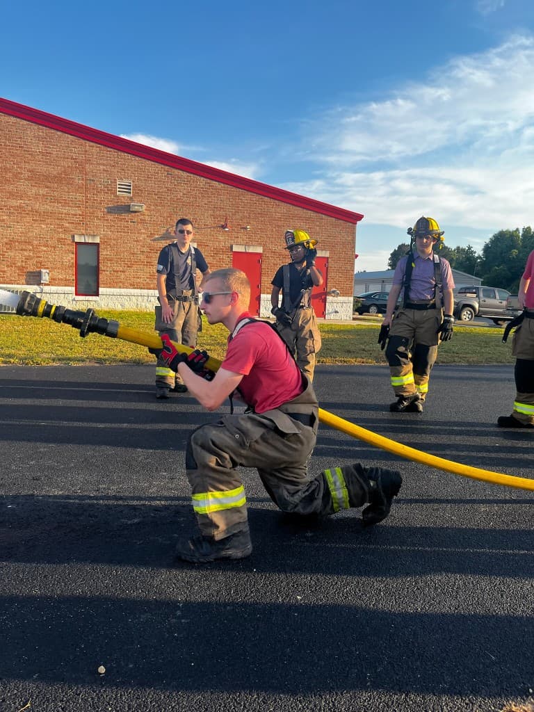 New Gaston Fire & Rescue members learning fire hose operations during hands-on training