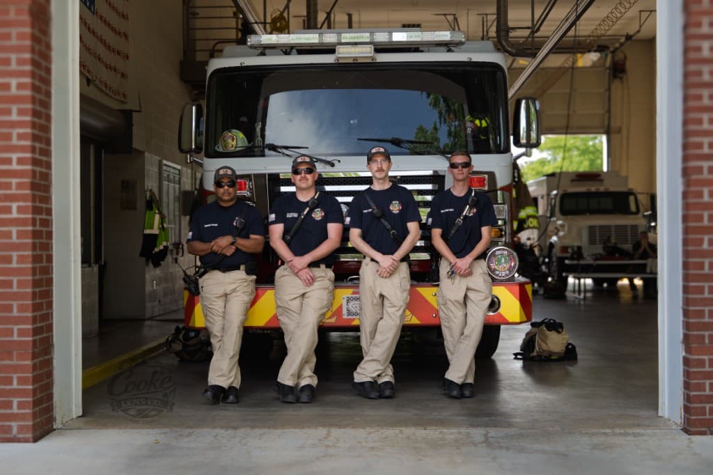 Gaston Fire & Rescue volunteers of different ages and backgrounds standing together in turnout gear