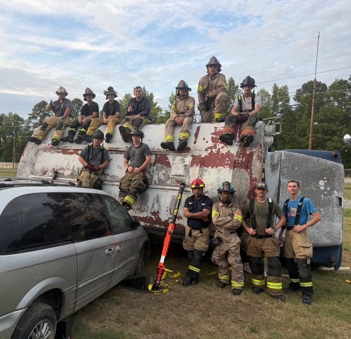 Firefighters from Gaston and nearby departments gathered beside an overturned activity bus after rescue training